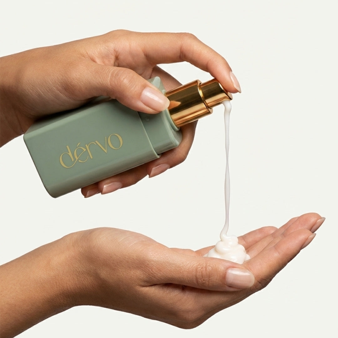 dérvo' with hyration cream being dispensed onto a palm before applying to face
